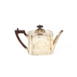 A Victorian silver teapot, having foliate engraved decoration, with blackwood handle and lift,