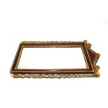 A Georgian mahogany and gilt wood applied wall mirror, with floral decoration, 79cm x 46cm overall