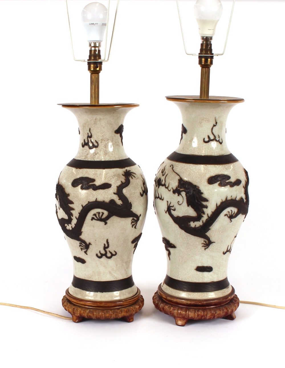 A pair of antique Chinese baluster vases, converted to table lamps, decorated bronzed raised