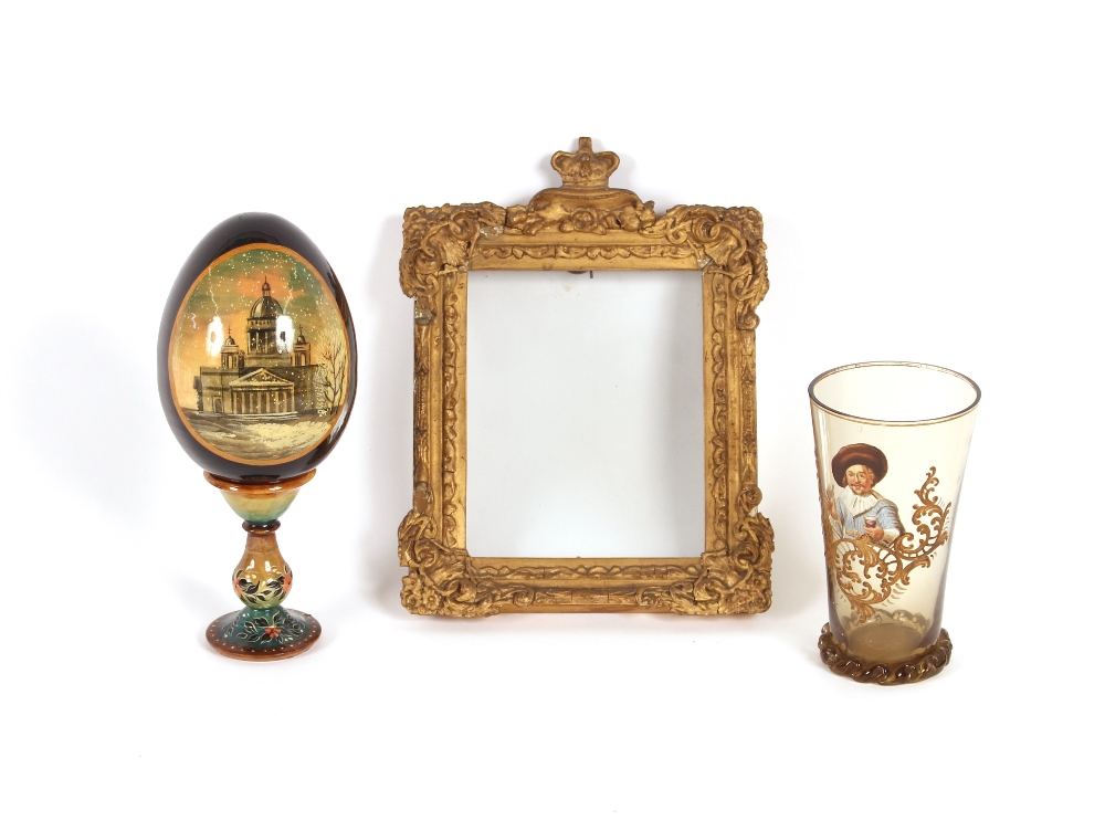 An enameled glass goblet, with cavalier decoration; a Russian papier maché and lacquered egg; and