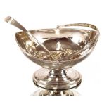 A George III silver swing handled sugar basket, by Peter and Ann Bateman, with foliate trailing