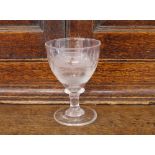 A Masonic etched wine glass, decorated with various symbols, inscribed "INRI" and initialed with a