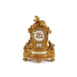 A 19th Century French gilt metal mantel clock, decorated with Sevres style porcelain panels,