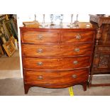 A Georgian mahogany bow front chest, of two short and three long drawers, raised on bracket feet,