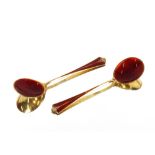 A pair of Continental .925 mark red enamel spoons, in box
