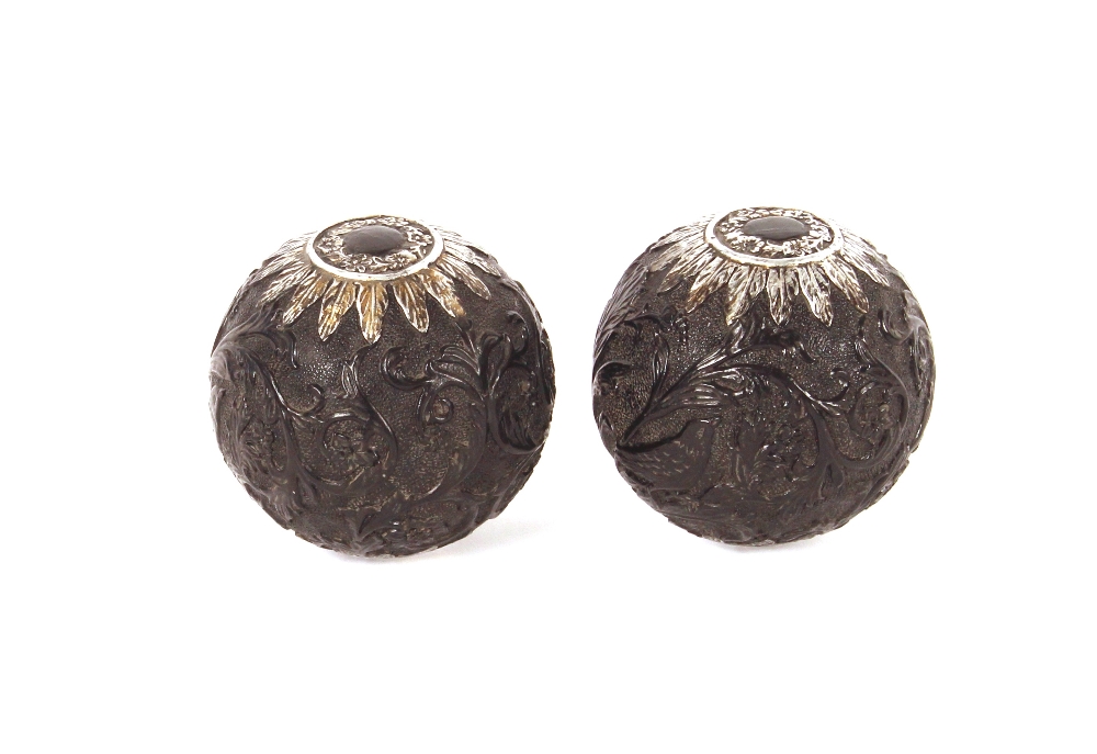 A pair of 19th Century Eastern carved spherical Areca Palm nuts, in the 18th Century style, finely