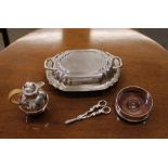An electro plated two handled entree dish; a plated coaster with mahogany base; a pair of plated