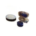A blue uncut opal and two cut opals