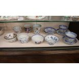A small collection of 18th Century Worcester, famille rose and other tea bowls, modern Chinese tea