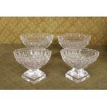 A set of four Antique cut glass pedestal salts, of boat shape, raised on faceted bases with