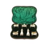 A cased silver matched seven piece cruet, with matched associated spoons mostly by Walker & Hall