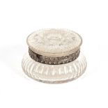 A cut glass hinged dressing table powder jar, with floral decorated white metal mounts, 15cm dia.