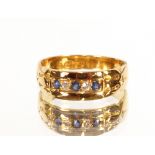 An 18 carat gold sapphire and diamond ring, dated 1916, size M