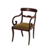 A set of six Regency mahogany bar back dining chairs, with upholstered drop-in seats, raised on