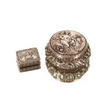 A late 18th/early 19th Century Continental white metal circular box, decorated with buildings, fruit
