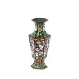 An Oriental cloisonne octagonal vase, profusely decorated with flowers, 15cm