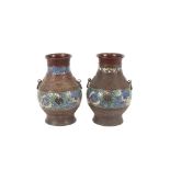 A pair of late 19th / early 20th Century Chinese bronzed and cloisonné panel vases, of baluster form