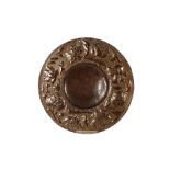 A 17th Century style sheet copper charger, the borders with embossed stylised artichoke,