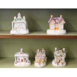 Five various Victorian Staffordshire and Coalport pastille burner cottages, mostly with floral