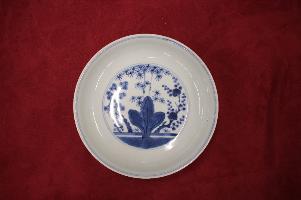 A Chinese blue and white shallow dish, the central field decorated with flowers, 20.5cm dia. six - Image 8 of 13