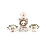 A 19th Century German porcelain clock garniture, decorated with scenes of romantic couples and