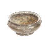 A Liberty & Co., spot hammered pewter fruit bowl, with raised stylised decoration, designed by