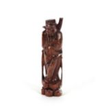 A Chinese hardwood and white metal inlaid figure, of an immortal, 30cm high