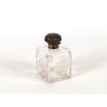 A square cut glass scent bottle, with silver mounts