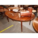 A Georgian mahogany drop leaf dining table, the rounded leaves raised on square tapering supports,