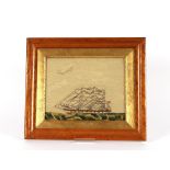 A 19th Century woolwork picture, of a ship in full sail, contained in a maple frame, image 21cm x