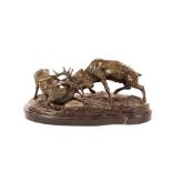 P.J.Mene, a bronze figure group depicting fighting stags, raised on oval marble plinth, 43cm long,