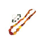 An antique gold and agate bracelet; together with amber necklace and various beads