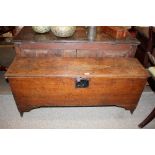 An 18th Century oak coffer, having candle box interior, square iron lock plate and hasp raised on