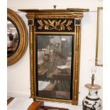 An early 19th Century gilt framed pier mirror, having breakfront pediment above a panel decorated