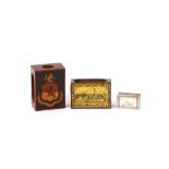 A painted wooden matchbox holder, decorated with a coat of arms; a Bryant & May tin matchbox holder,