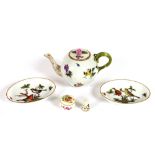 A Herend porcelain bullet shaped teapot; two Herend oval pin dishes with bird and floral decoration;