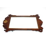 A 19th Century mahogany fret carved framed wall mirror, in the Chippendale manner, having gilt shell
