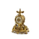 A 19th Century French brass mantel clock, surmounted by an urn with ram's head mask and pineapple