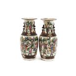A pair of 19th Century Chinese baluster vases, decorated in coloured enamels with scenes of warriors