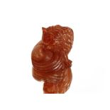 An oriental resin Netsuke, in the form of a recumbent cat