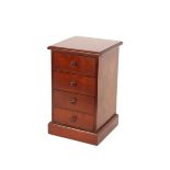 A mahogany trinket chest, fitted four drawers and raised on a platform plinth, 21cm wide x 22.5cm