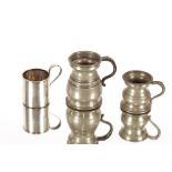 An Antique silver miniature mug; and two Antique pewter measures (3)