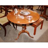 A 19th Century mahogany tilt top occasional table, raised on a tripod base and pad feet, 81cm dia.