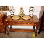 A late 19th / early 20th Century mahogany writing table, in the aesthetic movement style fitted