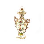 A 19th Century Paris porcelain vase and cover, profusely decorated with exotic birds perched on