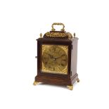 An early 20th Century oak cased and brass mounted bracket clock, having pierced foliate decoration