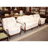A good quality mahogany framed three piece suite, in the Regency style upholstered in Greek Key