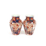 A pair of Imari baluster vases, decorated in the traditional palette, 25cm high