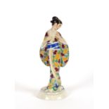 An Oriental Art Deco porcelain figure of a Geisha girl, in brightly coloured robes, 29cm high