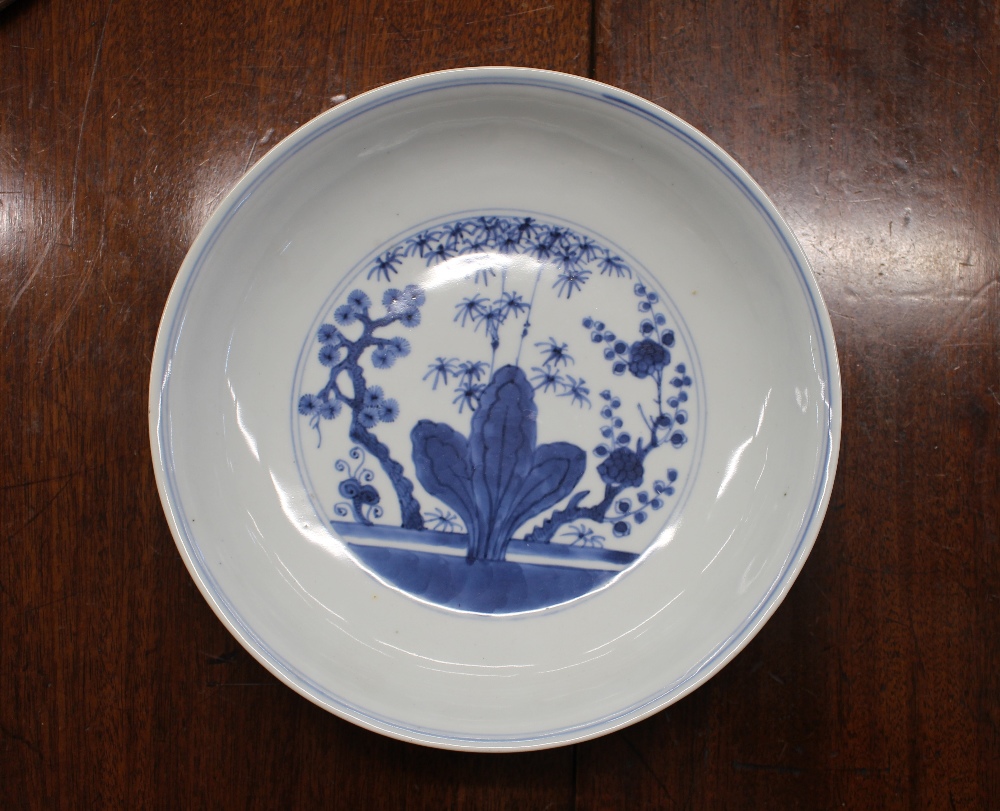 A Chinese blue and white shallow dish, the central field decorated with flowers, 20.5cm dia. six - Image 2 of 13